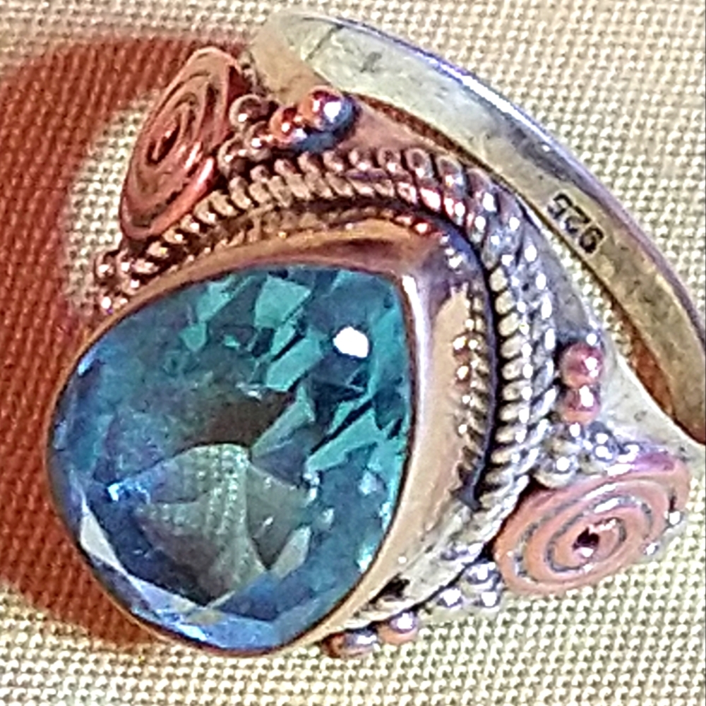 LONDON BLUE TOPAZ, PROFESSIONALLY FACETED INTO A TEARDROP SHAPE. STERLING.